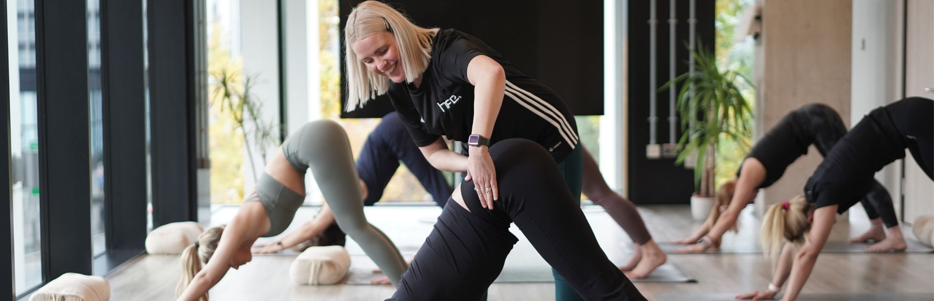 HFE yoga teacher leading yoga class