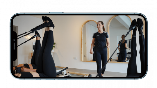 reformer Pilates course shown on iPhone screen